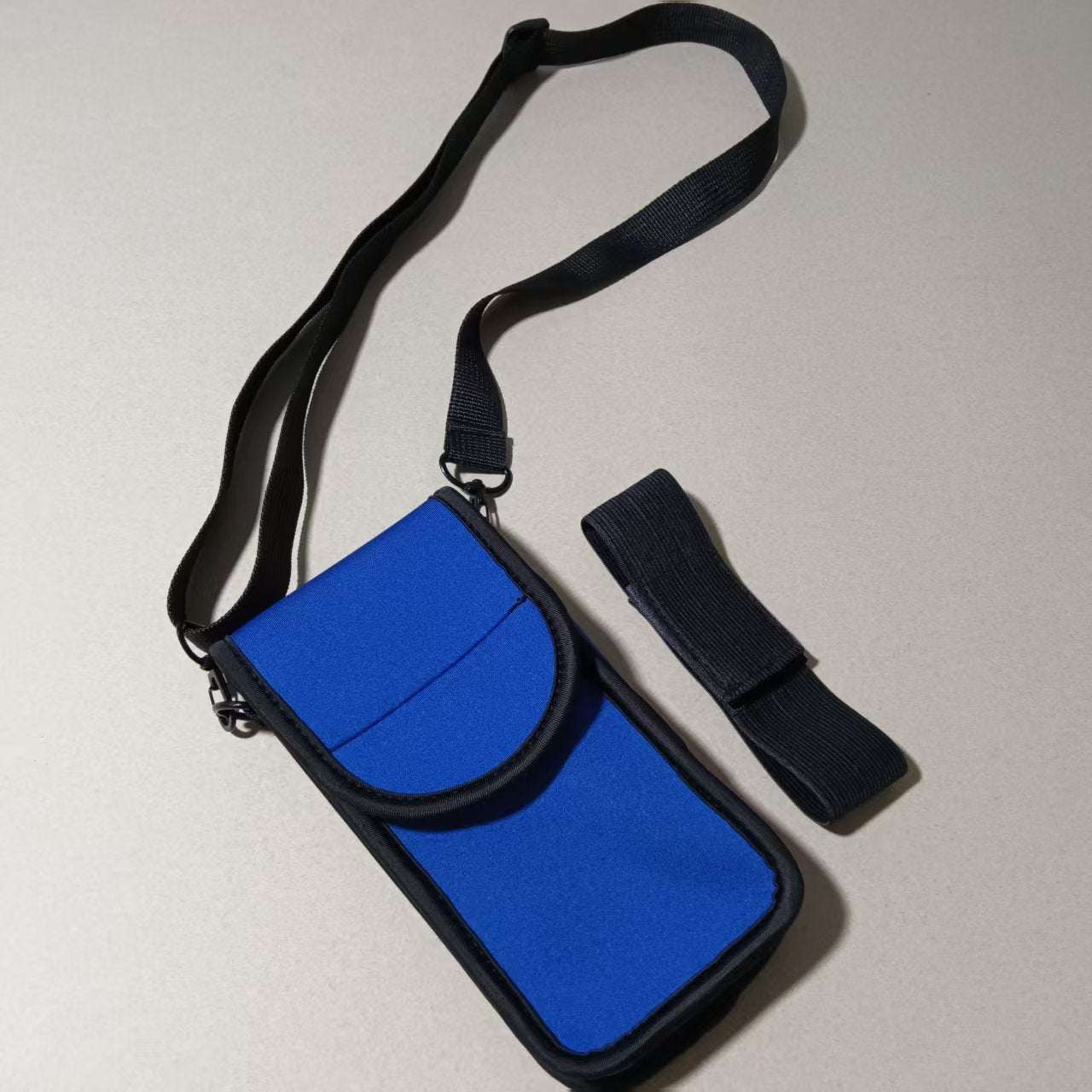 Cell Phone Holster in blue with adjustable strap and secure closure for riding and outdoor activities.