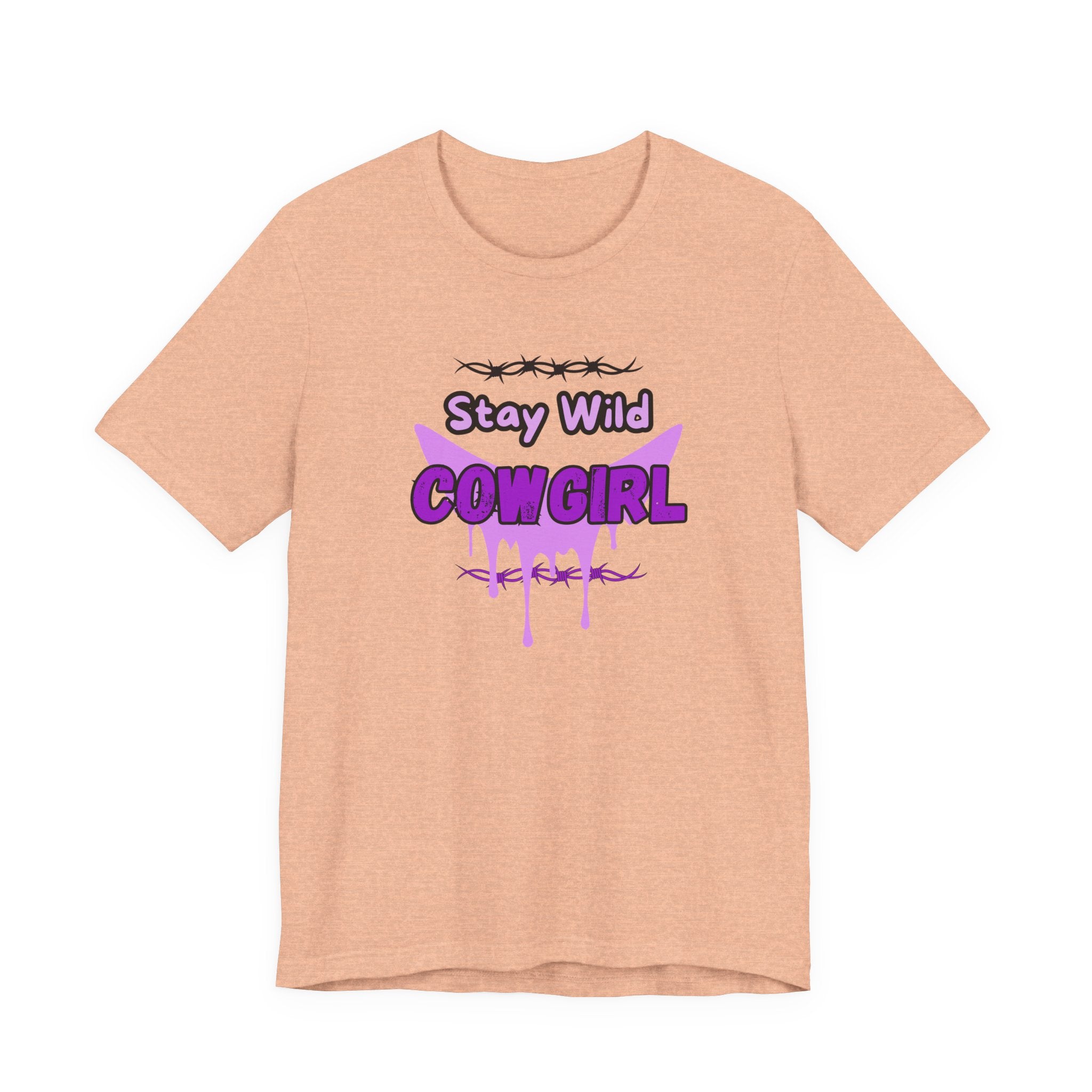 Cowgirl Western Tee with playful 'Stay Wild COWGIRL' graphic in purple on a light peach background.