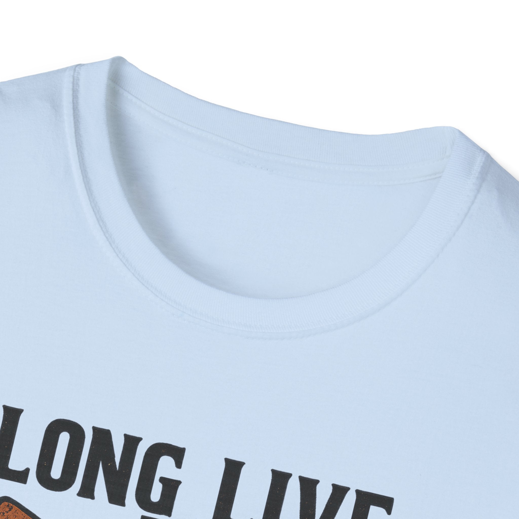 Woman wearing Long Live the Cowgirl horseshoe graphic t-shirt, showcasing cowgirl apparel with a relaxed smile.