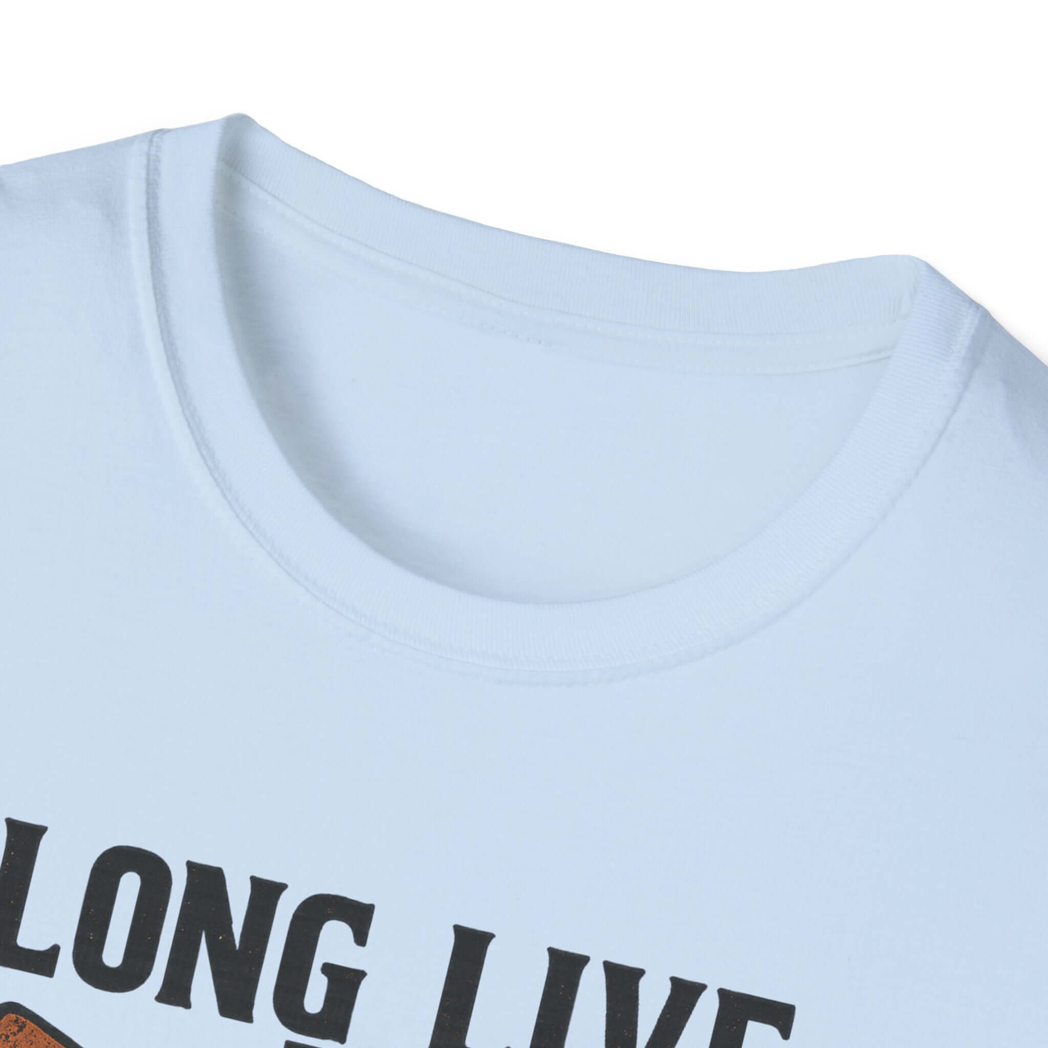 Woman wearing Long Live the Cowgirl horseshoe graphic t-shirt, showcasing cowgirl apparel with a relaxed smile.