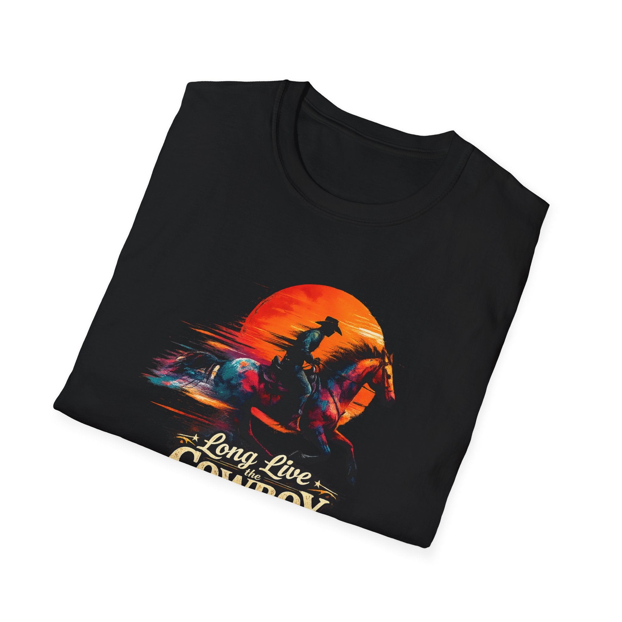 Folded black t-shirt with "Long Live the Cowboy" graphic and horse silhouette against a sunset background.