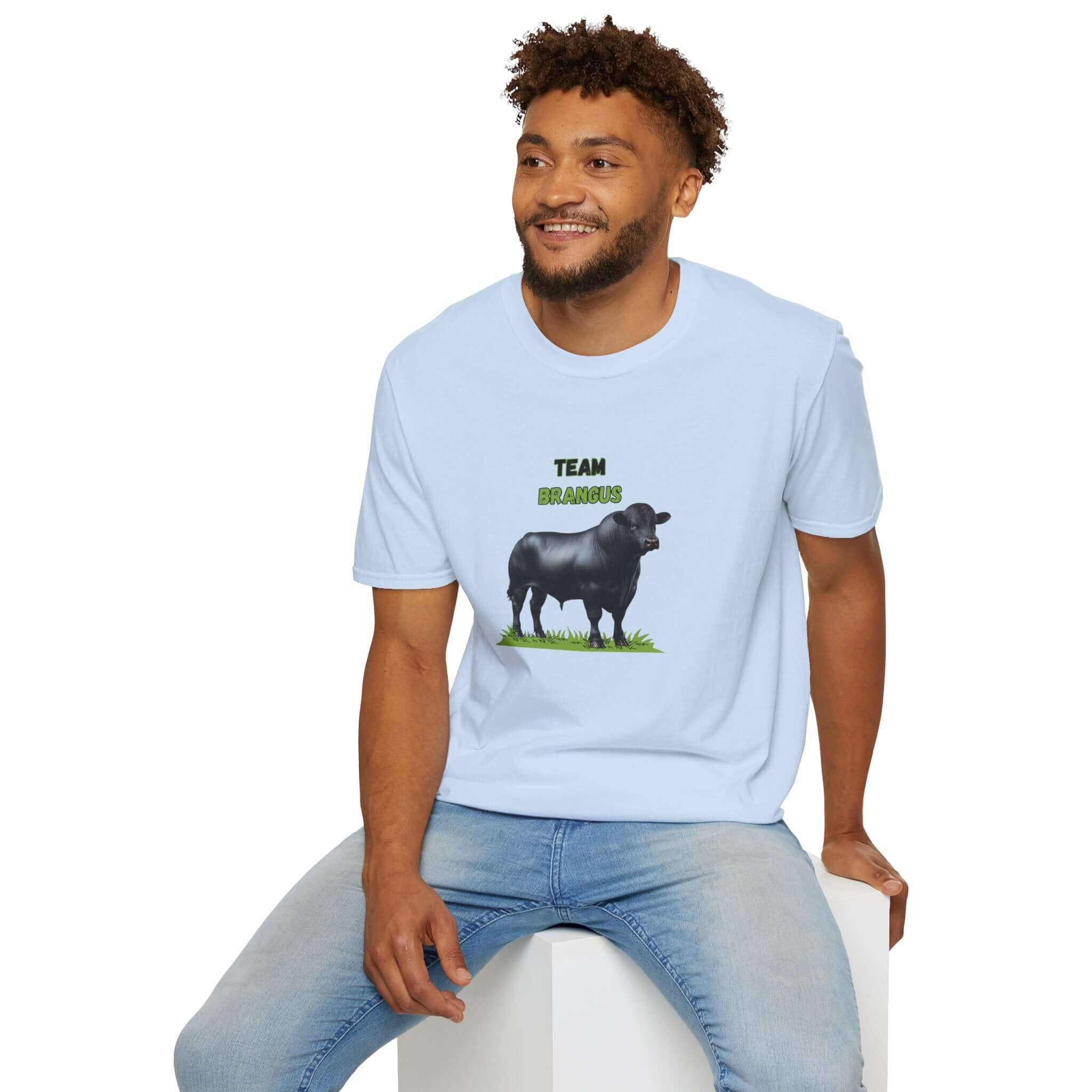 Man wearing a light blue Brangus Cattle Farmer Tee featuring a cow and 'Team Brangus' print.