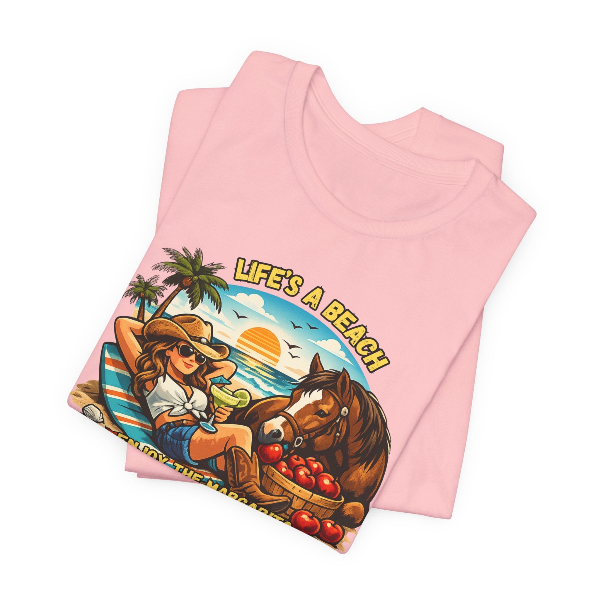 Life's A Beach Western Tee displayed in pink with sunset and beach graphic, perfect for cowgirl fashion and humor.