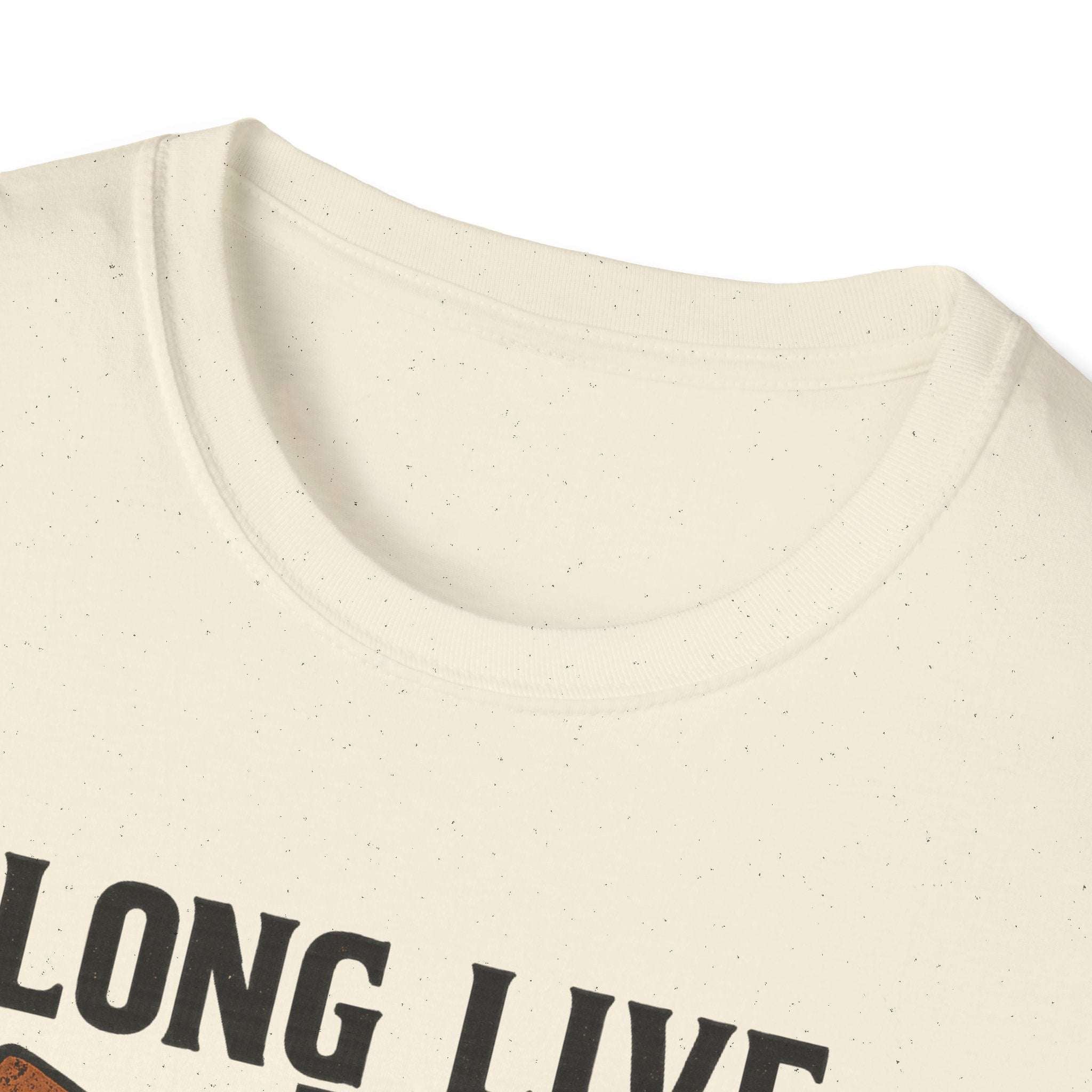 Woman wearing Long Live the Cowgirl horseshoe graphic t-shirt, showcasing cowgirl apparel with a relaxed smile.