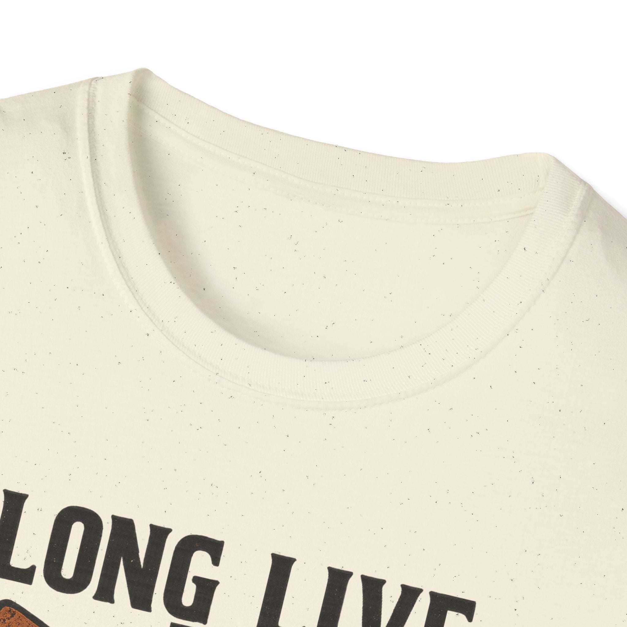 Woman wearing Long Live the Cowgirl horseshoe graphic t-shirt, showcasing cowgirl apparel with a relaxed smile.