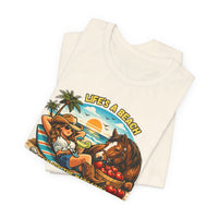 Life's A Beach Western Tee featuring a cowgirl, sunset, and horse, perfect for casual summer wear.