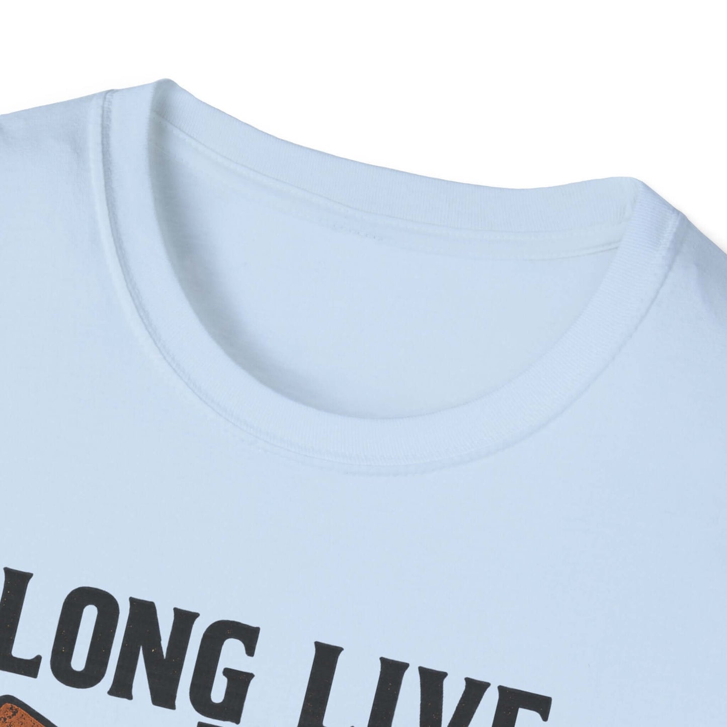  Woman wearing Long Live the Cowgirl horseshoe graphic t-shirt, showcasing cowgirl apparel with a relaxed smile.