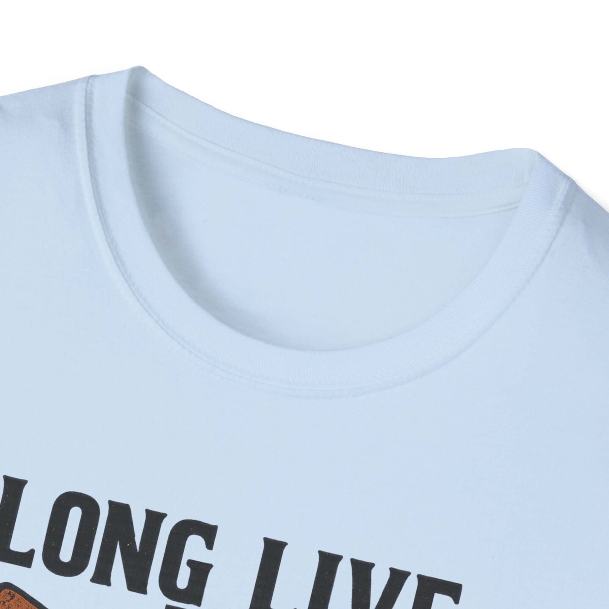  Woman wearing Long Live the Cowgirl horseshoe graphic t-shirt, showcasing cowgirl apparel with a relaxed smile.