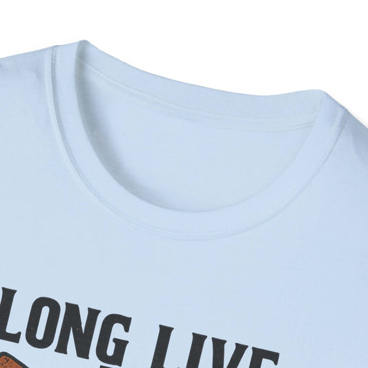  Woman wearing Long Live the Cowgirl horseshoe graphic t-shirt, showcasing cowgirl apparel with a relaxed smile.