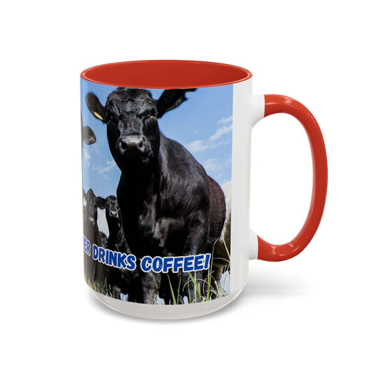 Black Angus Coffee Mug featuring a cow graphic and the phrase "Cow Drinks Coffee!" with a red handle.