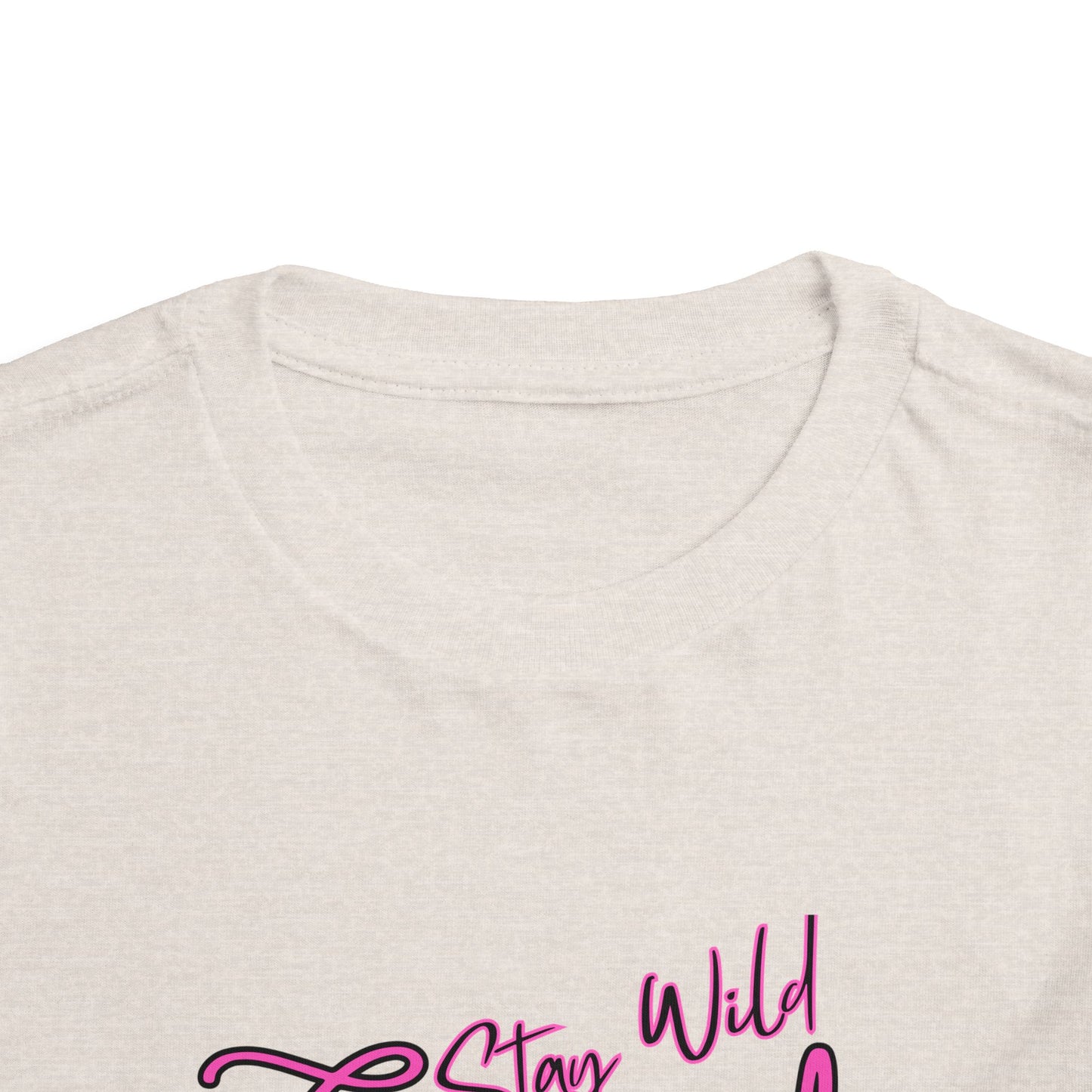 Toddler Cowgirl Tee showing the playful design "Stay Wild Cowgirl" on a soft cotton fabric.