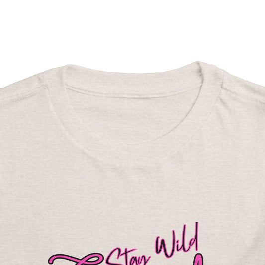 Toddler Cowgirl Tee showing the playful design "Stay Wild Cowgirl" on a soft cotton fabric.