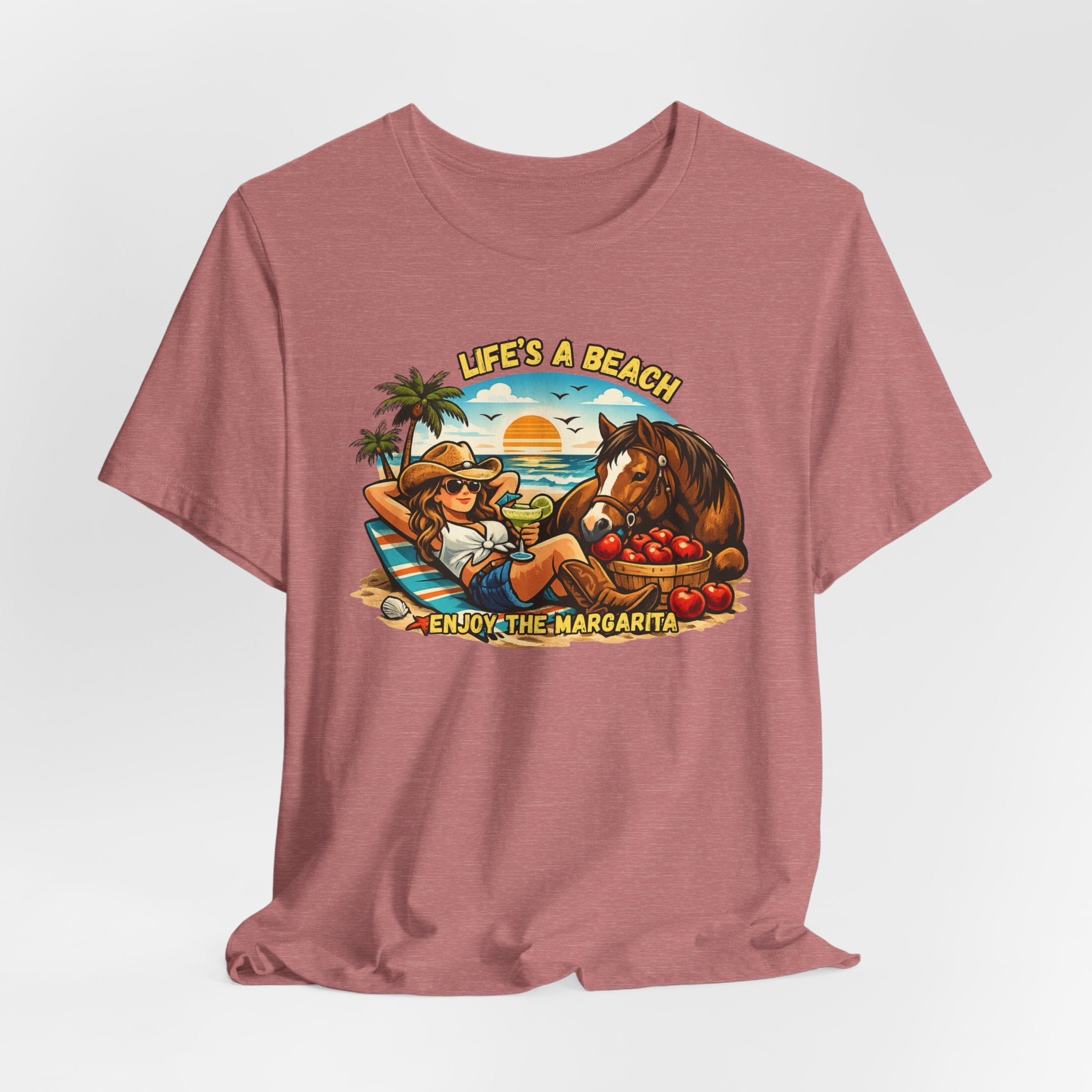 Life's A Beach Western Tee featuring a cowgirl relaxing with a horse, sun, and tropical elements, promoting beach vibes and humor.