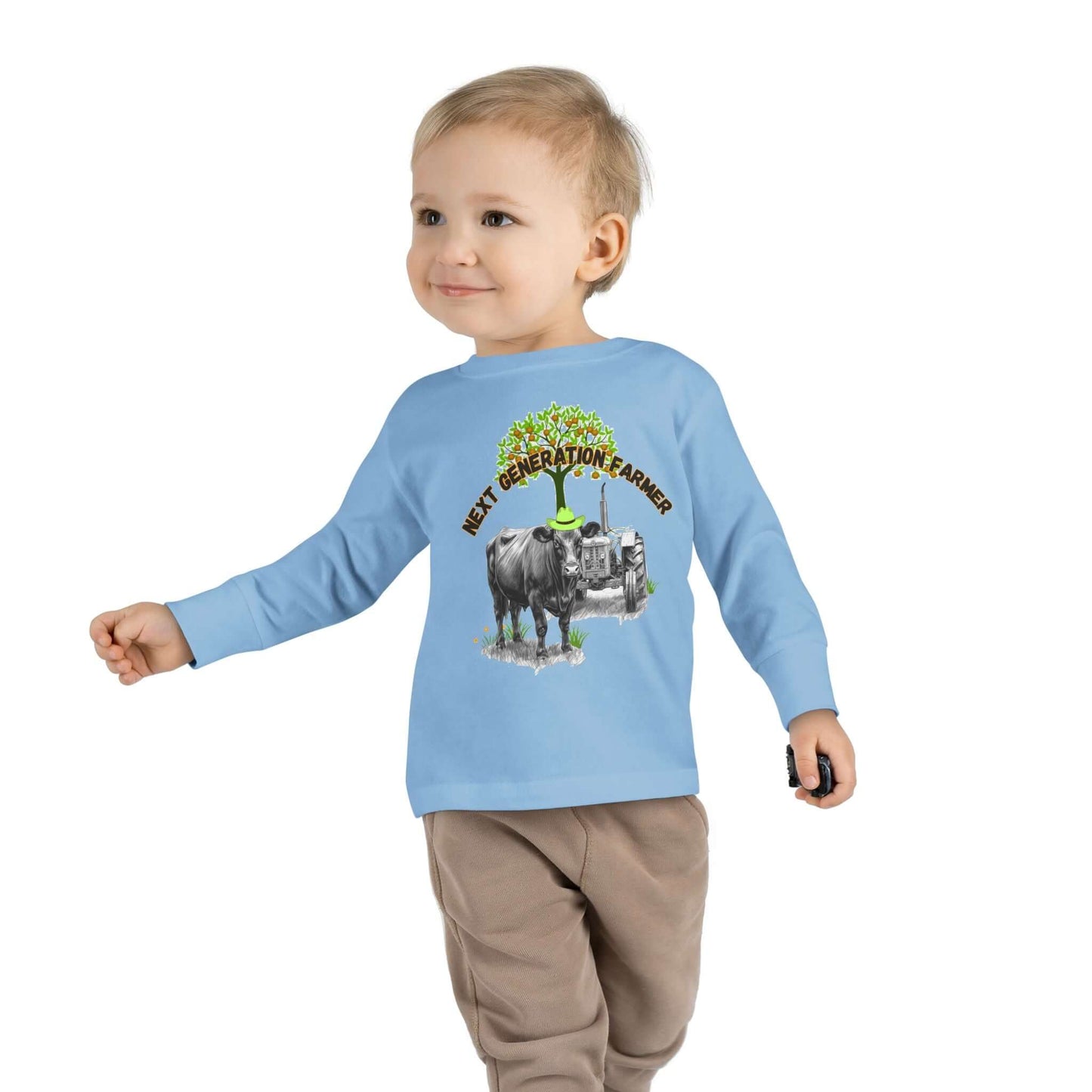 Toddler Long Sleeve Tee featuring 'Next Generation Farmer' graphic with tractor and cow, perfect for little farm enthusiasts.