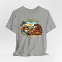 Life's A Beach Western Tee featuring a cowgirl relaxing with a drink and a horse against a sunset backdrop.