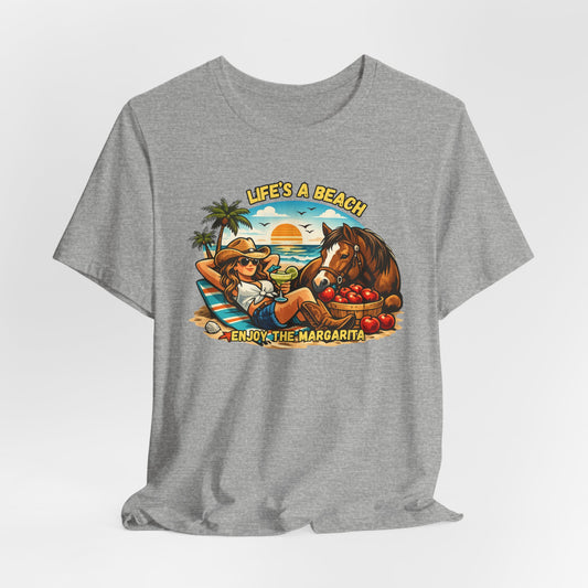 Life's A Beach Western Tee featuring a cowgirl relaxing with a drink and a horse against a sunset backdrop.