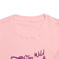 Toddler Cowgirl Tee featuring playful design that reads 'Stay Wild Cowgirl' on soft pink fabric.