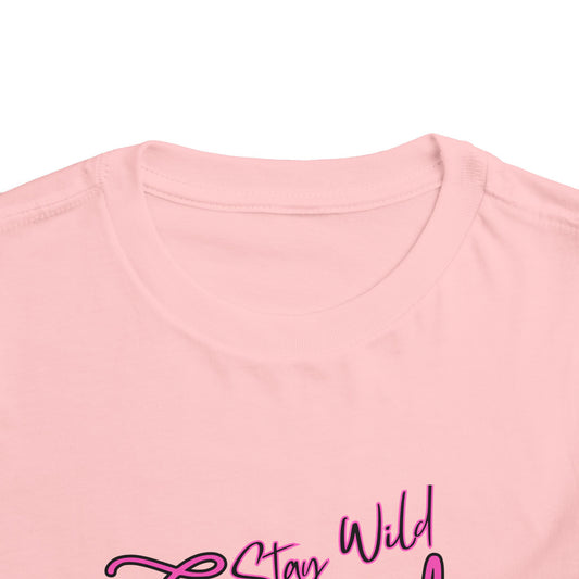 Toddler Cowgirl Tee featuring playful design that reads 'Stay Wild Cowgirl' on soft pink fabric.