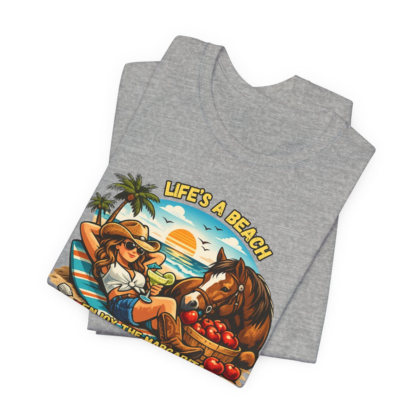 Life's A Beach Western Tee featuring a cowgirl enjoying a beach scene with a horse and sunset design.