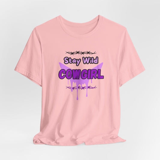 Cowgirl Western Tee featuring a bold purple graphic with barbed wire and the text "Stay Wild COWGIRL" on a pink background.