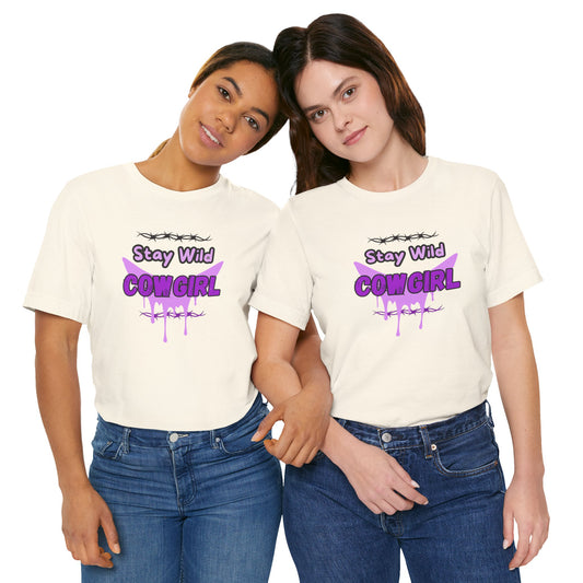 Two women wearing Cowgirl Western Tee with 'Stay Wild COWGIRL' graphic in purple on a white shirt.