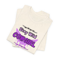 Cowgirl Western Tee featuring bold design with Stay Wild COWGIRL text and barbed wire graphic on a white shirt.