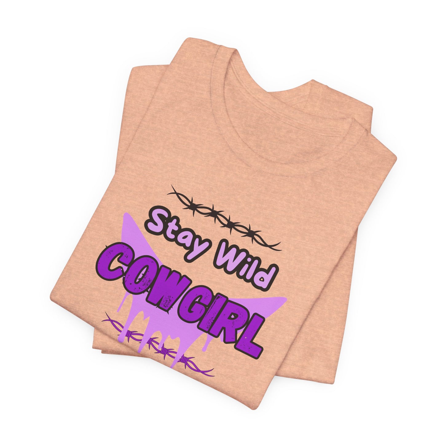 Cowgirl Western Tee featuring Stay Wild COWGIRL graphic on a soft peach-colored fabric.