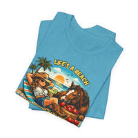 Life's A Beach Western Tee featuring a cowgirl, horse, and sunset design on a blue cotton shirt.