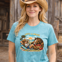 Life's A Beach Western Tee featuring a cowgirl, horse, and tropical scene on a blue shirt.
